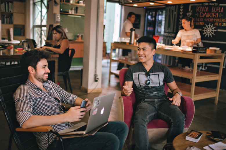 Creatives talking at a coffee shop.